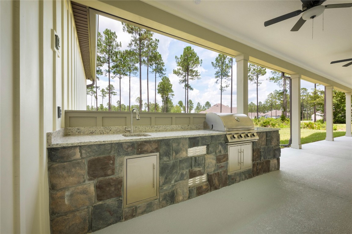 36199 Pitch Lane Hilliard, FL 32046 - Photo 40 of 40 a view of kitchen with stainless steel appliances granite countertop a stove and a sink