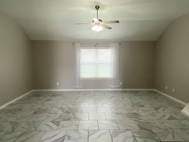 a view of an empty room and window