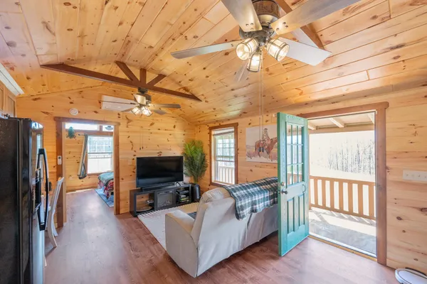 a living room with furniture and a flat screen tv