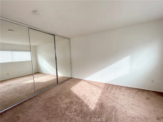 an empty room with fan