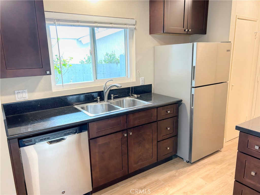 33938 Alcazar Drive, Unit A Dana Point, CA 92629 - Photo 3 of 29 a kitchen with a sink cabinets and window