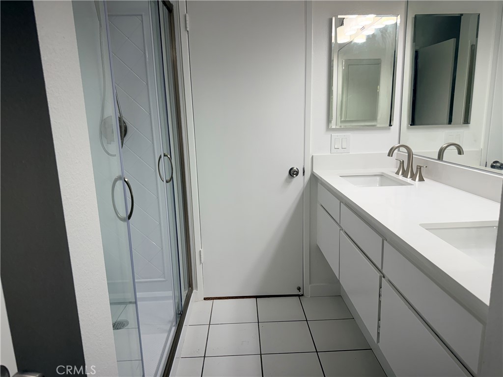 33938 Alcazar Drive, Unit A Dana Point, CA 92629 - Photo 7 of 29 a bathroom with a sink and a mirror
