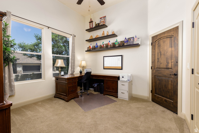 2005 West 450 S Circle St. George, UT 84770 - Photo 6 of 57 Room featuring a vaulted ceiling with a ceiling fan, dual large windows, and neutral carpeting