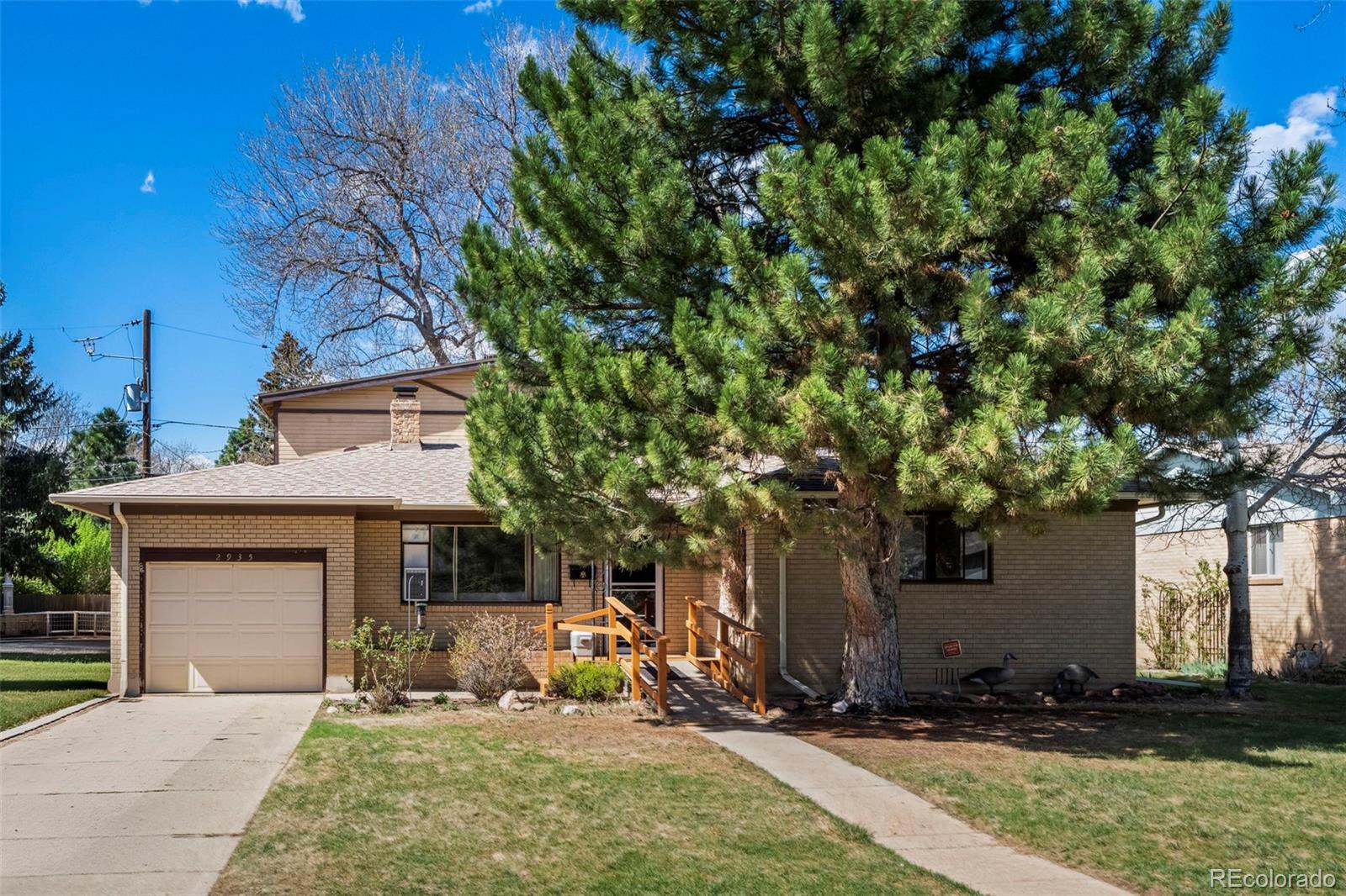 2935 17th Street Boulder, CO 80304 - Photo 1 of 38 a front view of a house with a yard