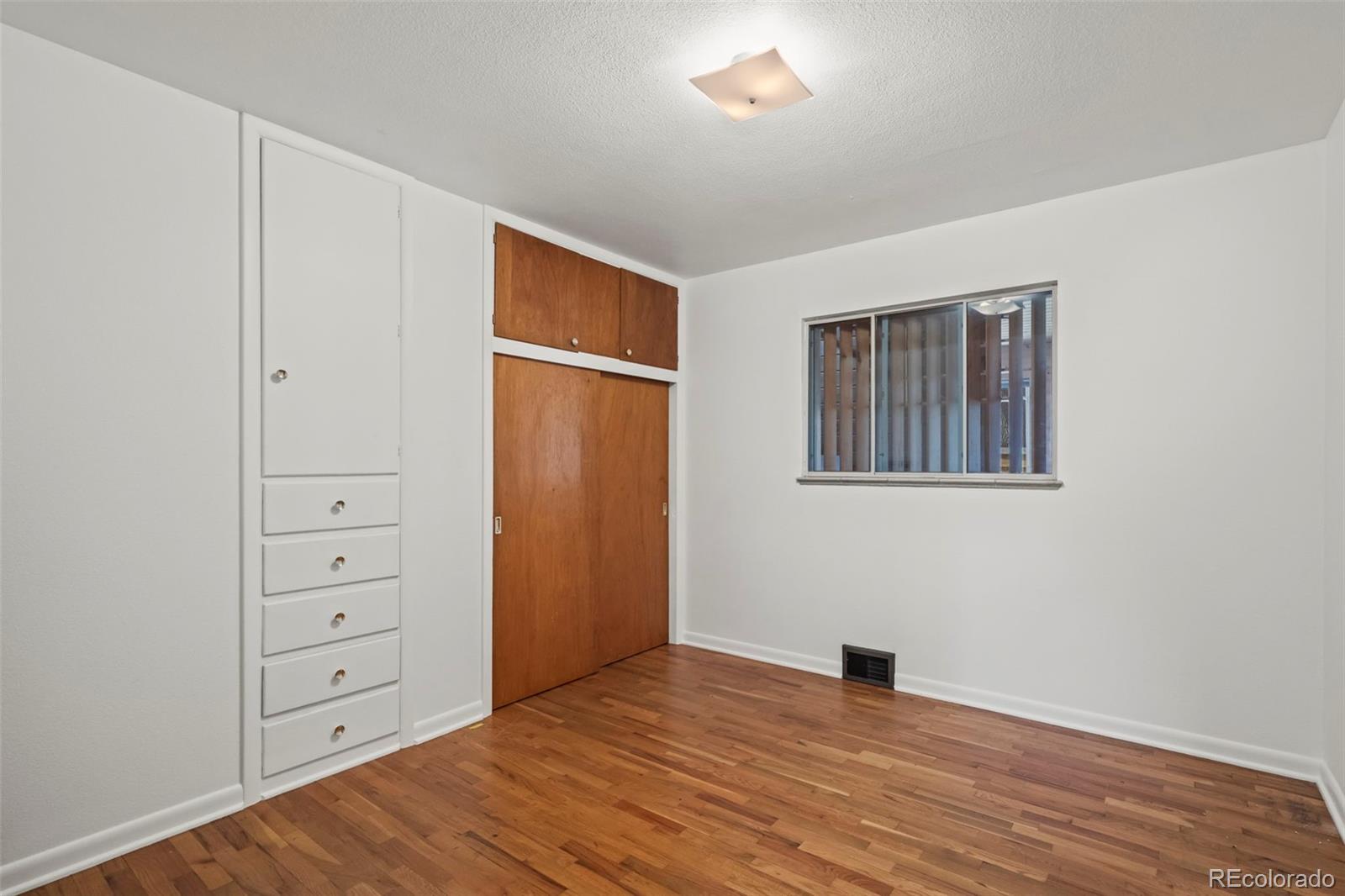 2935 17th Street Boulder, CO 80304 - Photo 13 of 38 a view of an empty room with wooden floor