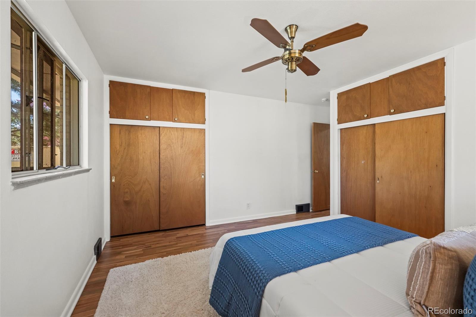 2935 17th Street Boulder, CO 80304 - Photo 16 of 38 a bedroom with a bed and a ceiling fan