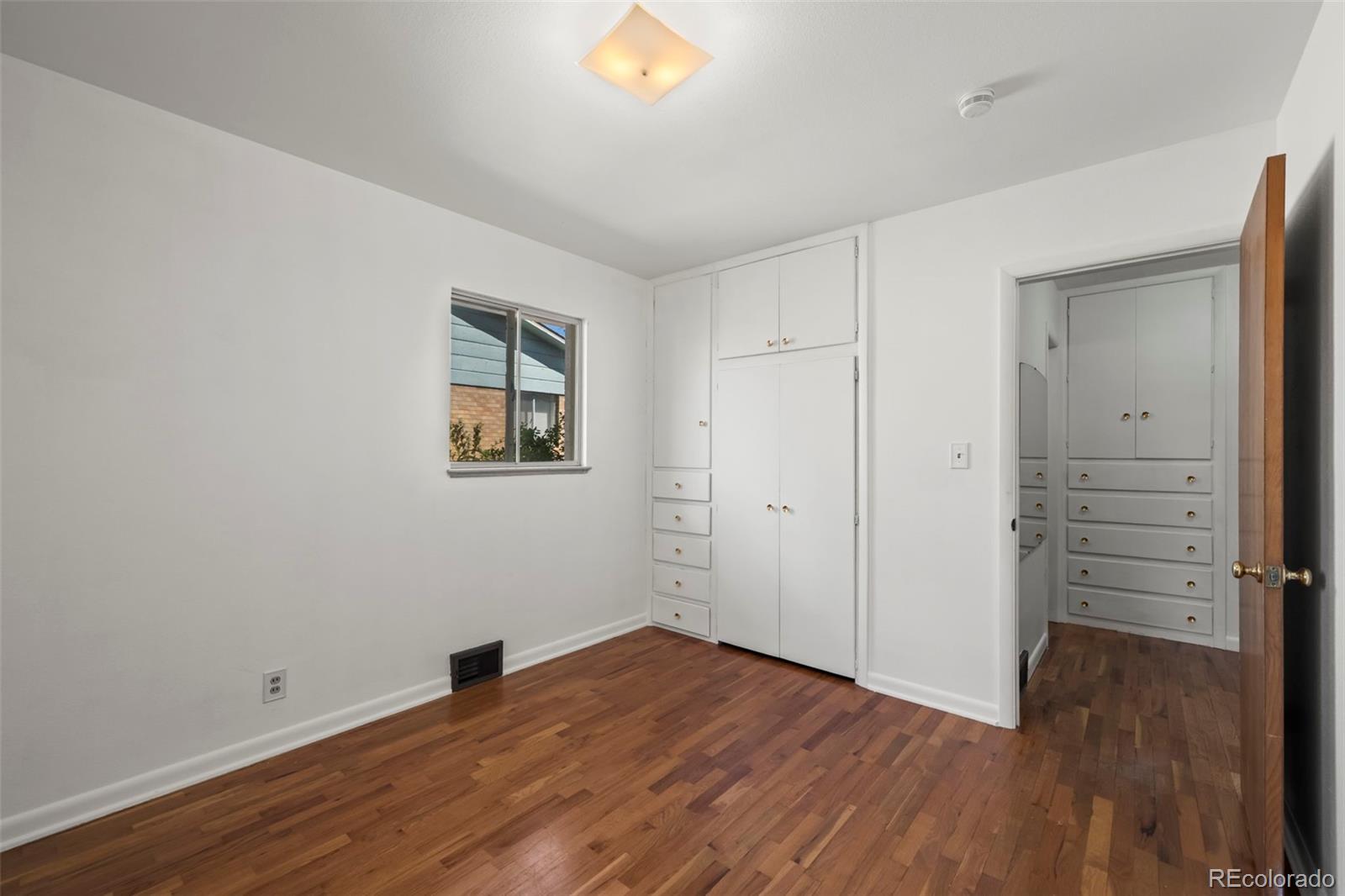 2935 17th Street Boulder, CO 80304 - Photo 18 of 38 a view of empty room with wooden floor and window