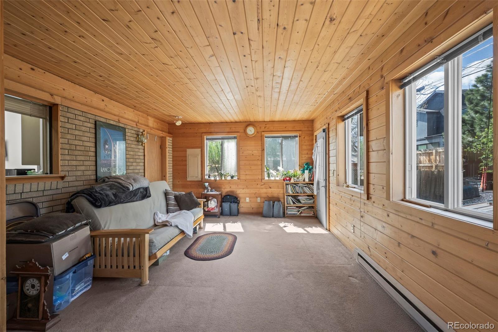 2935 17th Street Boulder, CO 80304 - Photo 21 of 38 a spacious bedroom with furniture and a large window