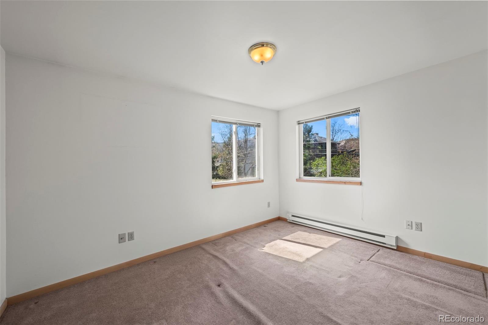 2935 17th Street Boulder, CO 80304 - Photo 25 of 38 an empty room with windows