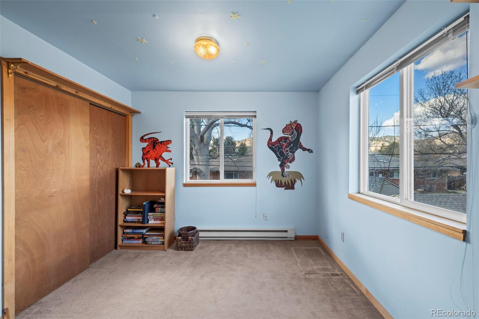 2935 17th Street Boulder, CO 80304 - Photo 28 of 38 an empty room with windows and fan