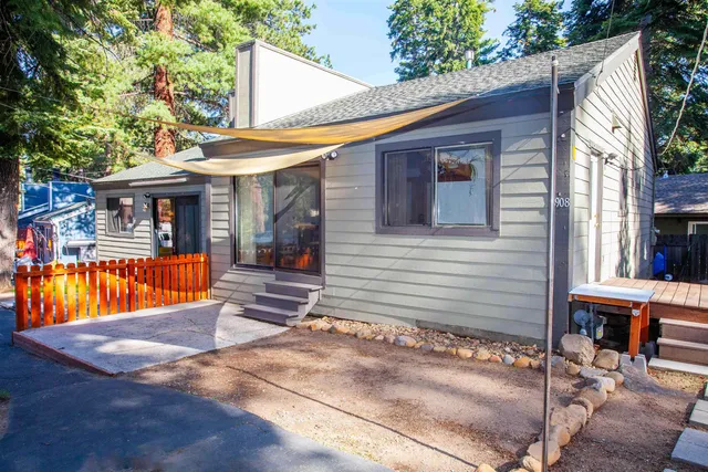 a view of house with outdoor seating