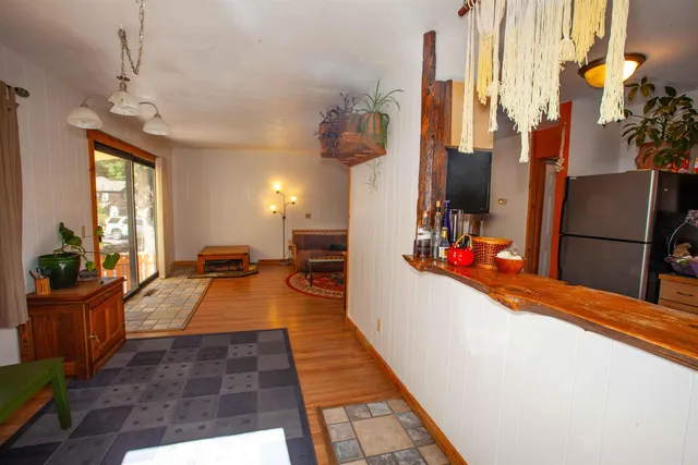 a view of a living room and kitchen