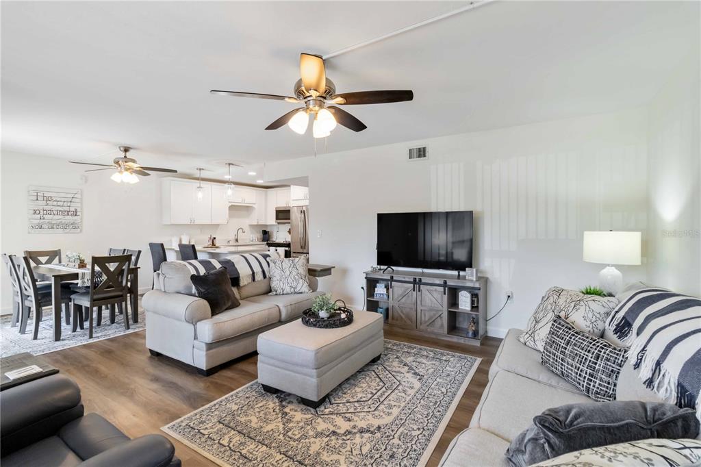 5416 Swift Road, Unit 27 Sarasota, FL 34231 - Photo 11 of 55 a living room with furniture and a flat screen tv