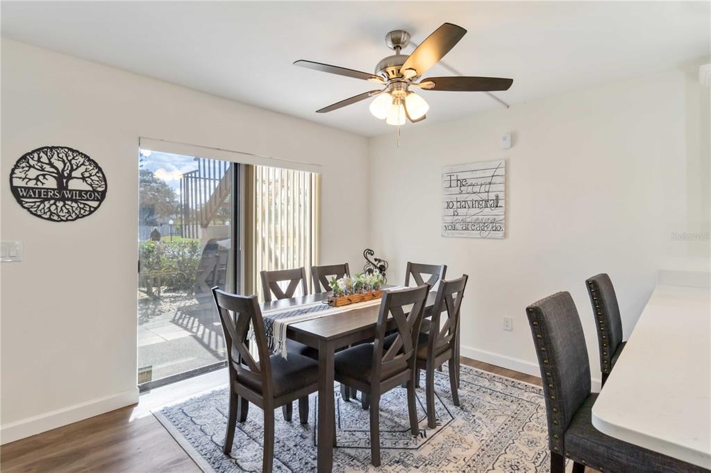 5416 Swift Road, Unit 27 Sarasota, FL 34231 - Photo 14 of 55 a view of a dining room with furniture window and wooden floor