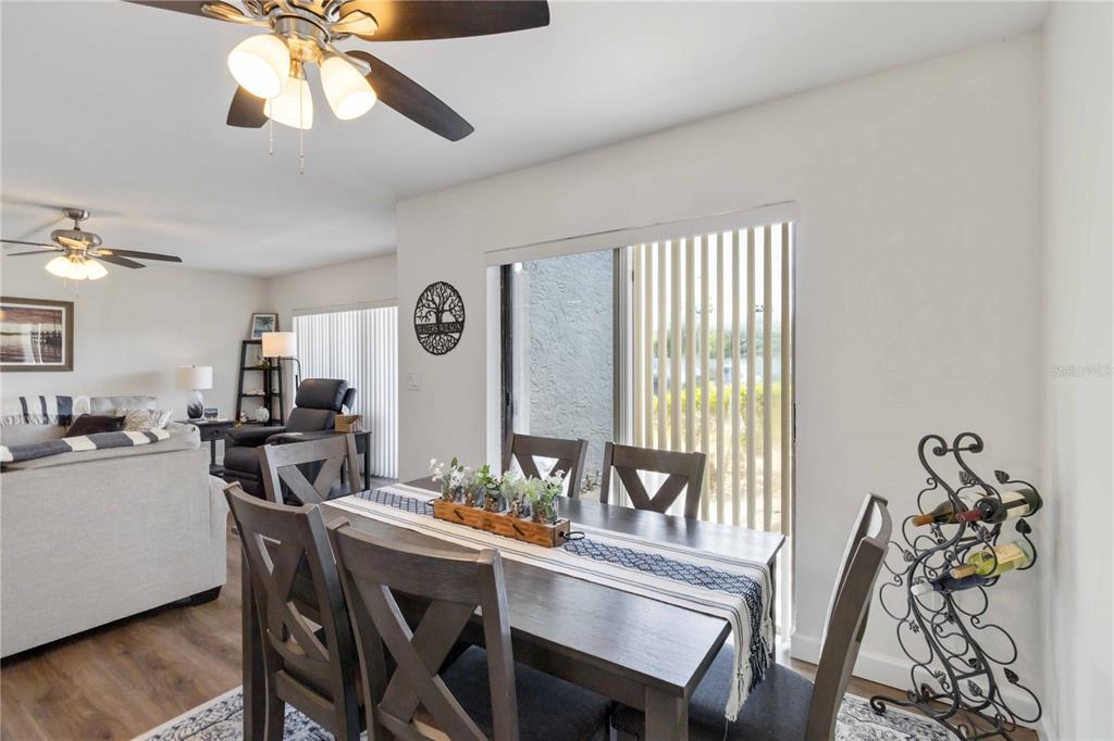 5416 Swift Road, Unit 27 Sarasota, FL 34231 - Photo 15 of 55 a view of a dining room with furniture window and outside view