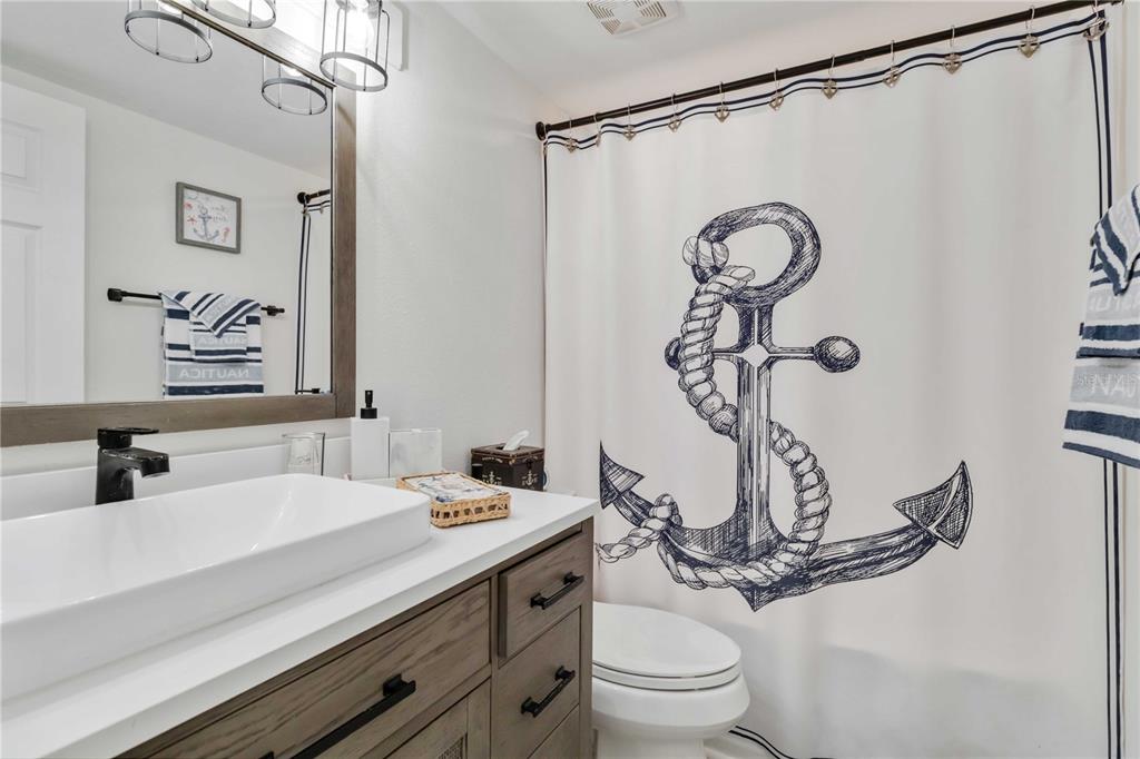 5416 Swift Road, Unit 27 Sarasota, FL 34231 - Photo 20 of 55 a bathroom with a sink and a mirror