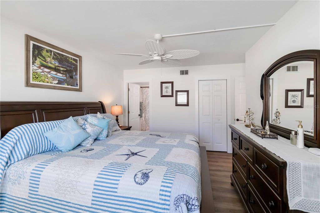 5416 Swift Road, Unit 27 Sarasota, FL 34231 - Photo 22 of 55 a bedroom with a bed and a dresser