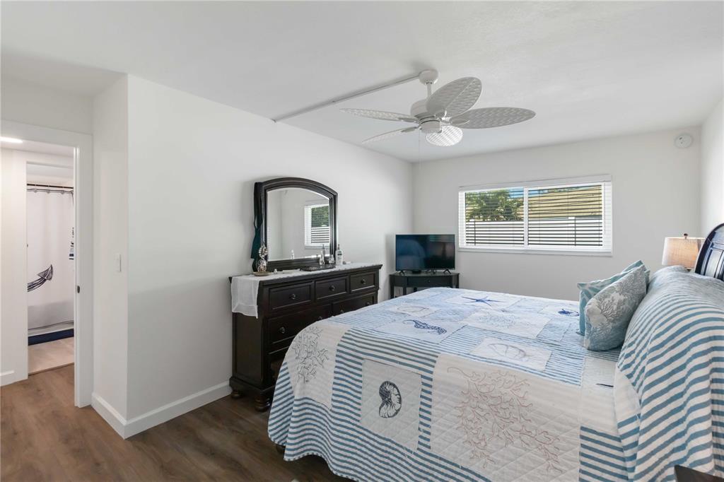 5416 Swift Road, Unit 27 Sarasota, FL 34231 - Photo 23 of 55 a bedroom with a bed and a window