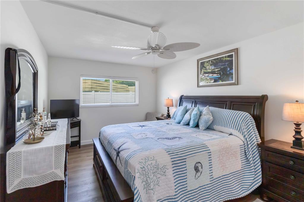 5416 Swift Road, Unit 27 Sarasota, FL 34231 - Photo 24 of 55 a bedroom with double bed and a window