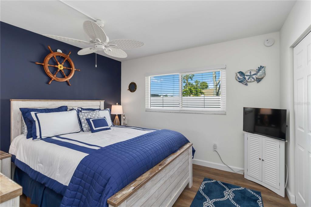 5416 Swift Road, Unit 27 Sarasota, FL 34231 - Photo 26 of 55 a bedroom with a large bed and a window