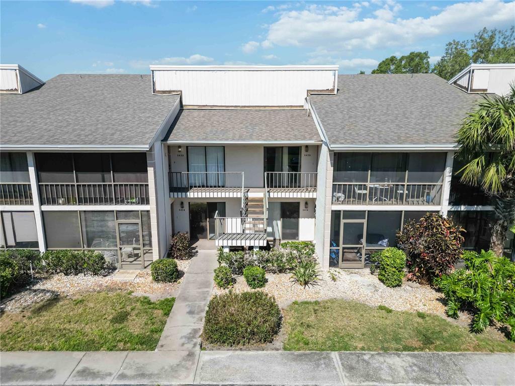 5416 Swift Road, Unit 27 Sarasota, FL 34231 - Photo 35 of 55 front view of a house with potted plants