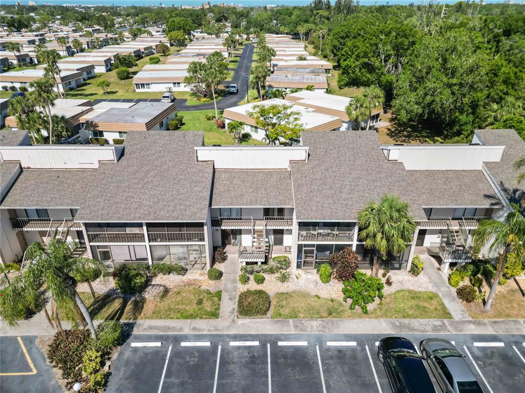 5416 Swift Road, Unit 27 Sarasota, FL 34231 - Photo 36 of 55 an aerial view of a house with garden space and sitting space
