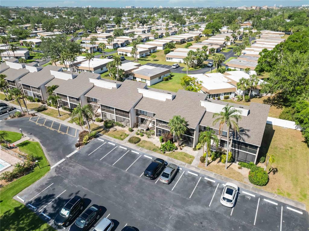 5416 Swift Road, Unit 27 Sarasota, FL 34231 - Photo 37 of 55 an aerial view of a swimming pool with outdoor seating