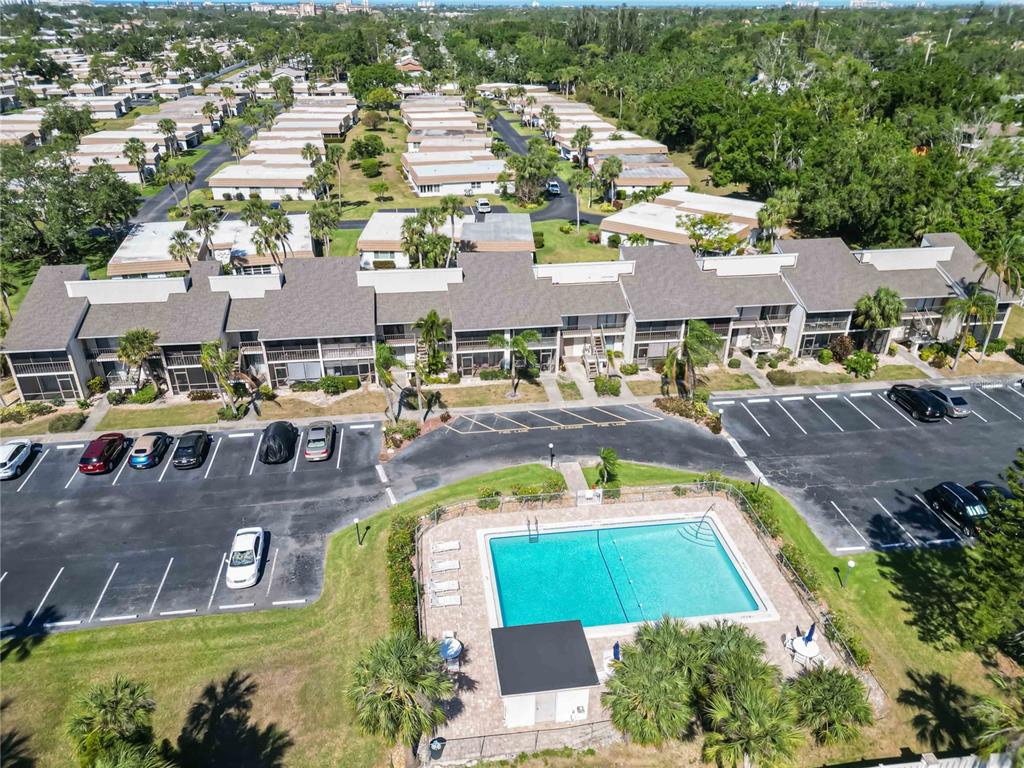 5416 Swift Road, Unit 27 Sarasota, FL 34231 - Photo 43 of 55 a view of a swimming pool with outdoor seating area