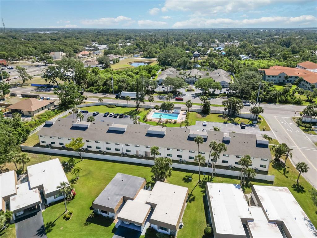 5416 Swift Road, Unit 27 Sarasota, FL 34231 - Photo 50 of 55 a view of swimming pool with outdoor seating