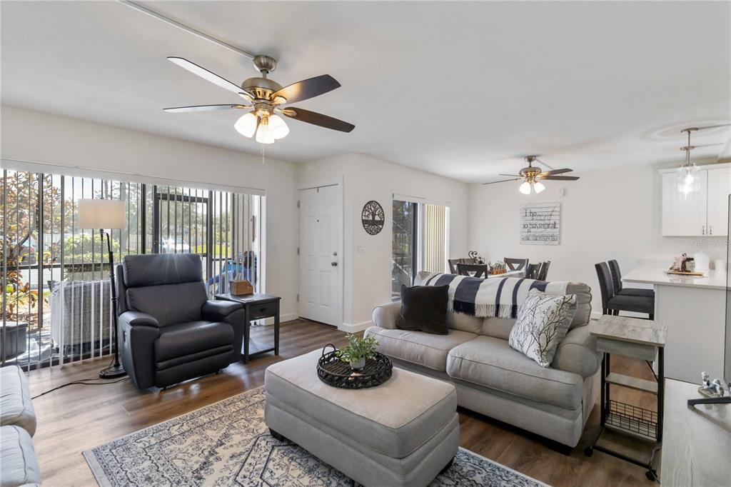 5416 Swift Road, Unit 27 Sarasota, FL 34231 - Photo 8 of 55 a living room with furniture and a ceiling fan