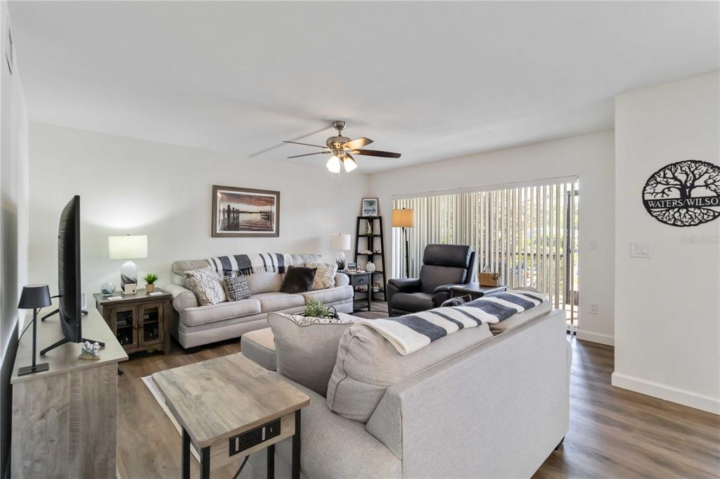 5416 Swift Road, Unit 27 Sarasota, FL 34231 - Photo 10 of 55 a living room with furniture and a large window