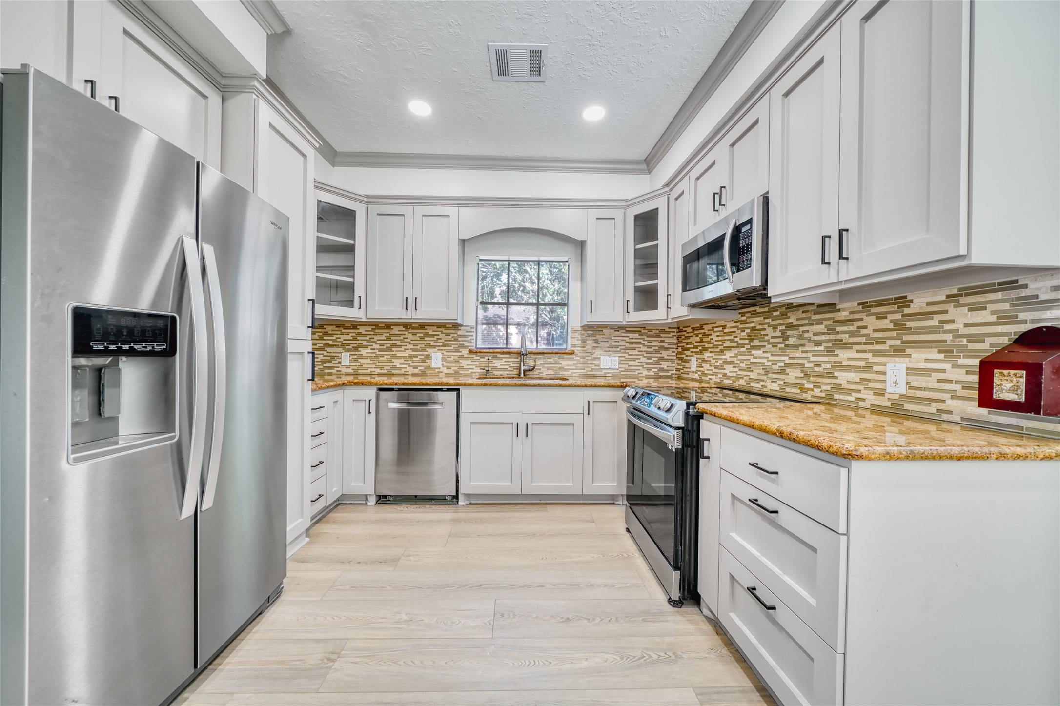 8006 Albin Lane Houston, TX 77071 - Photo 11 of 31 a kitchen with stainless steel appliances granite countertop a refrigerator and a stove