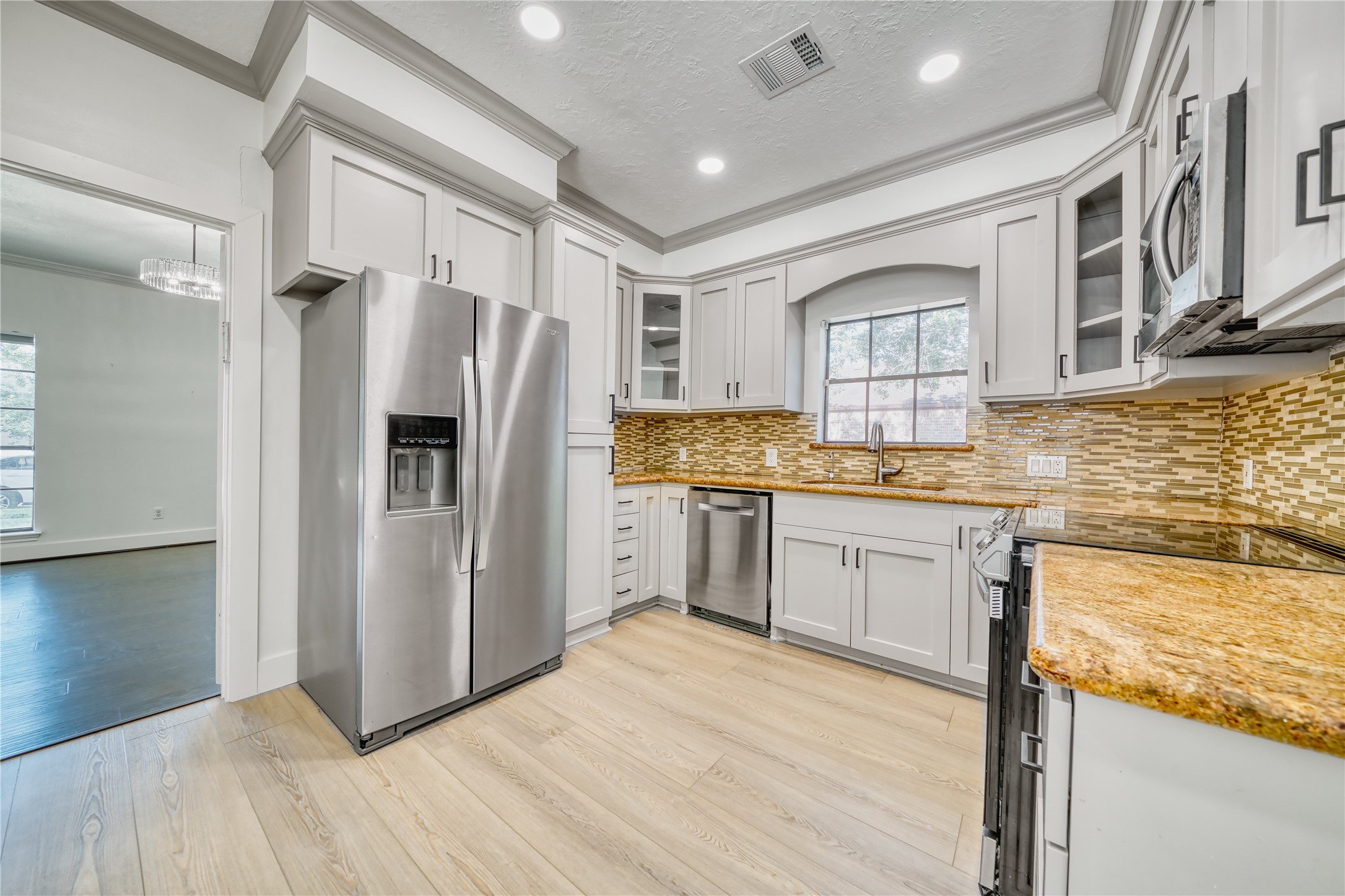 8006 Albin Lane Houston, TX 77071 - Photo 13 of 31 a kitchen with granite countertop a refrigerator and a sink