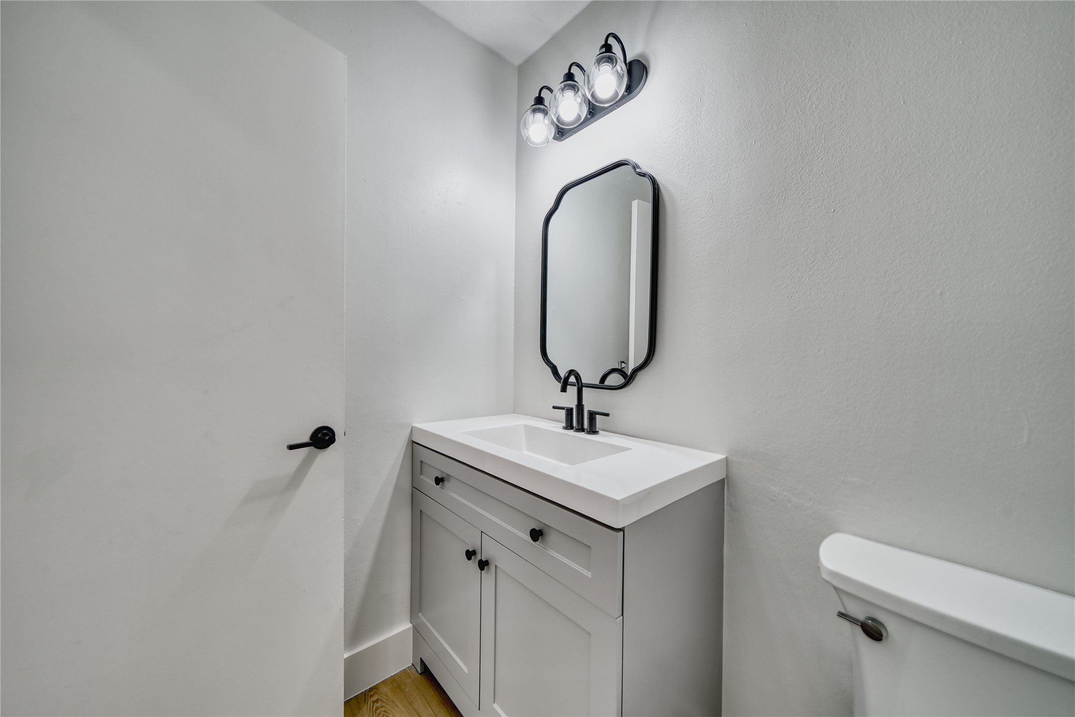 8006 Albin Lane Houston, TX 77071 - Photo 16 of 31 a bathroom with a sink mirror and vanity