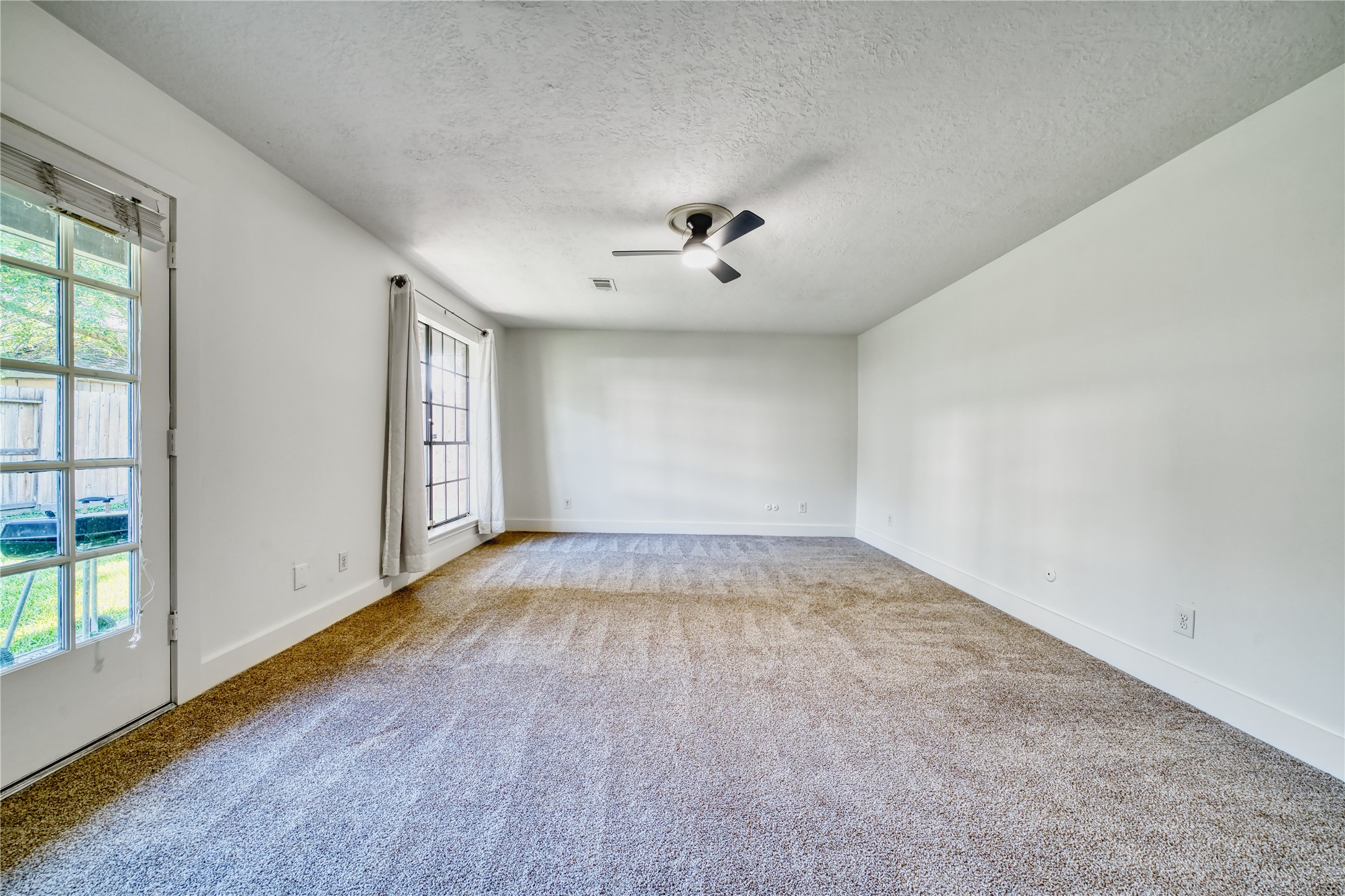 8006 Albin Lane Houston, TX 77071 - Photo 20 of 31 wooden floor in an empty room with a window