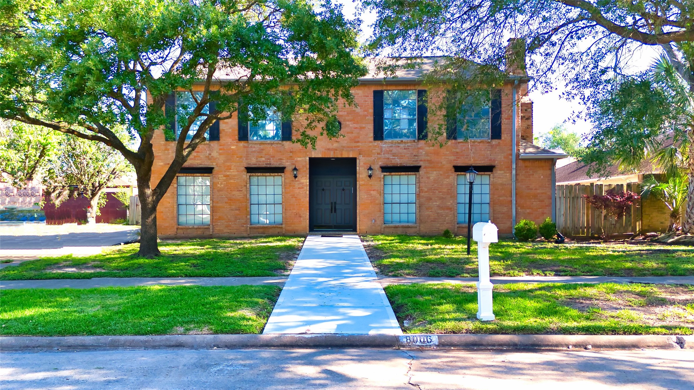 8006 Albin Lane Houston, TX 77071 - Photo 3 of 31 a front view of a house with a yard