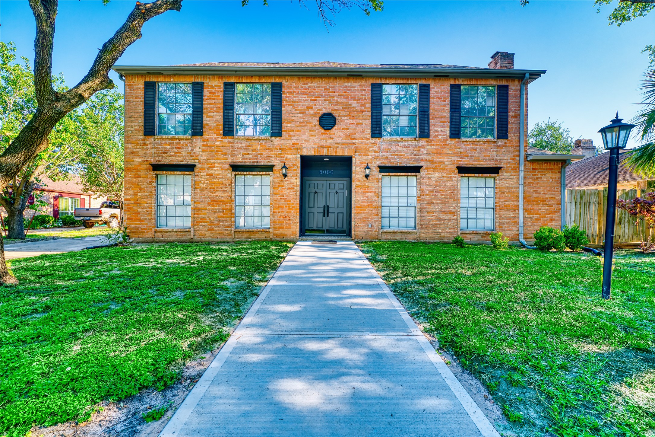 8006 Albin Lane Houston, TX 77071 - Photo 4 of 31 a front view of a house with garden