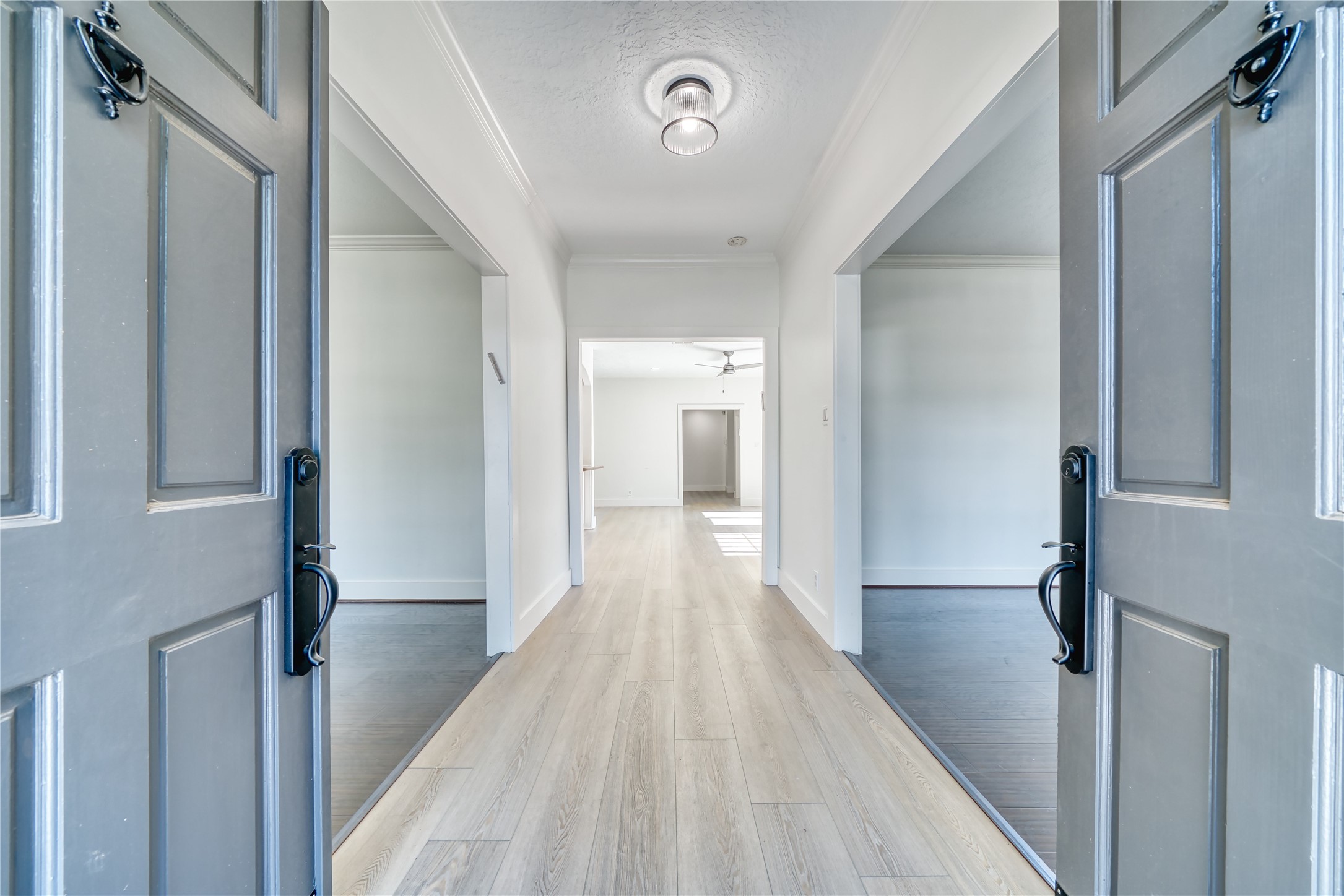 8006 Albin Lane Houston, TX 77071 - Photo 5 of 31 a view of a hallway with wooden floor and staircase