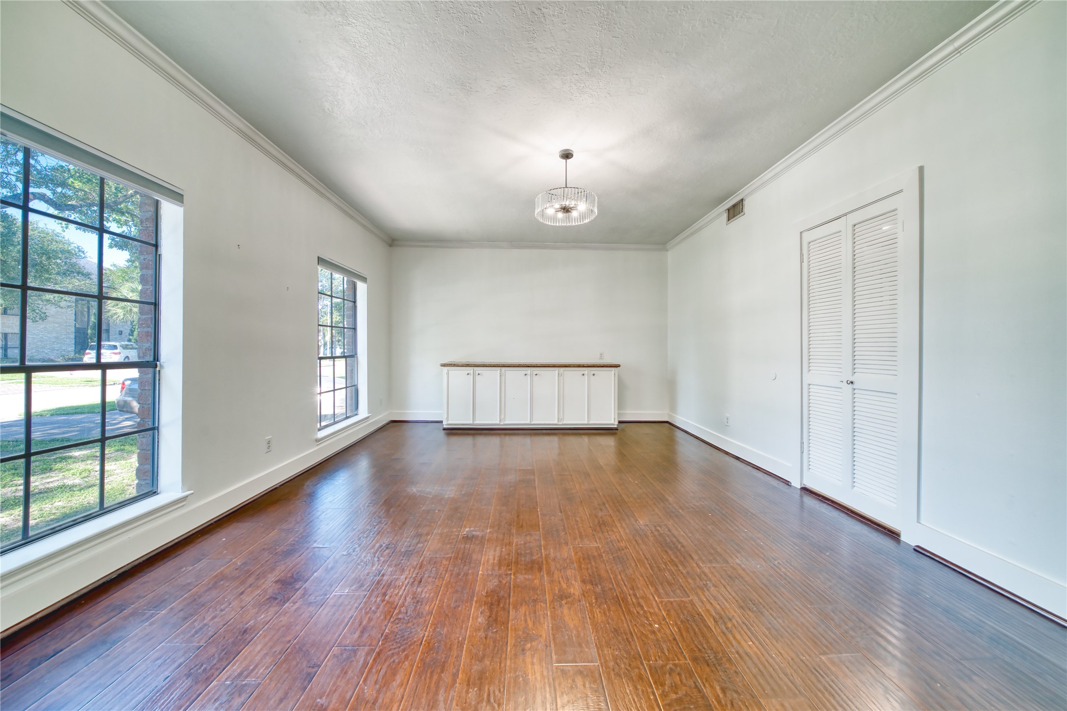 8006 Albin Lane Houston, TX 77071 - Photo 6 of 31 wooden floor in an empty room with a window