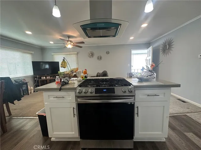 a kitchen with a stove and a sink