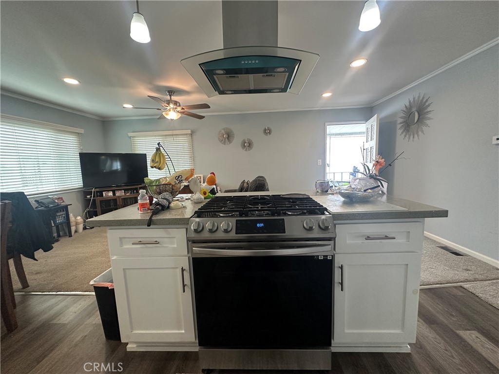 525 North Gilbert Street, Unit 151 Anaheim, CA 92801 - Photo 13 of 18 a kitchen with a stove and a sink