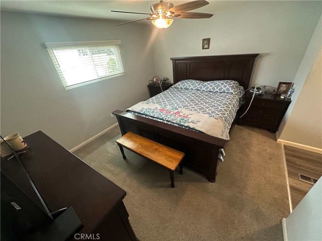 525 North Gilbert Street, Unit 151 Anaheim, CA 92801 - Photo 18 of 18 a bedroom with a bed and a window