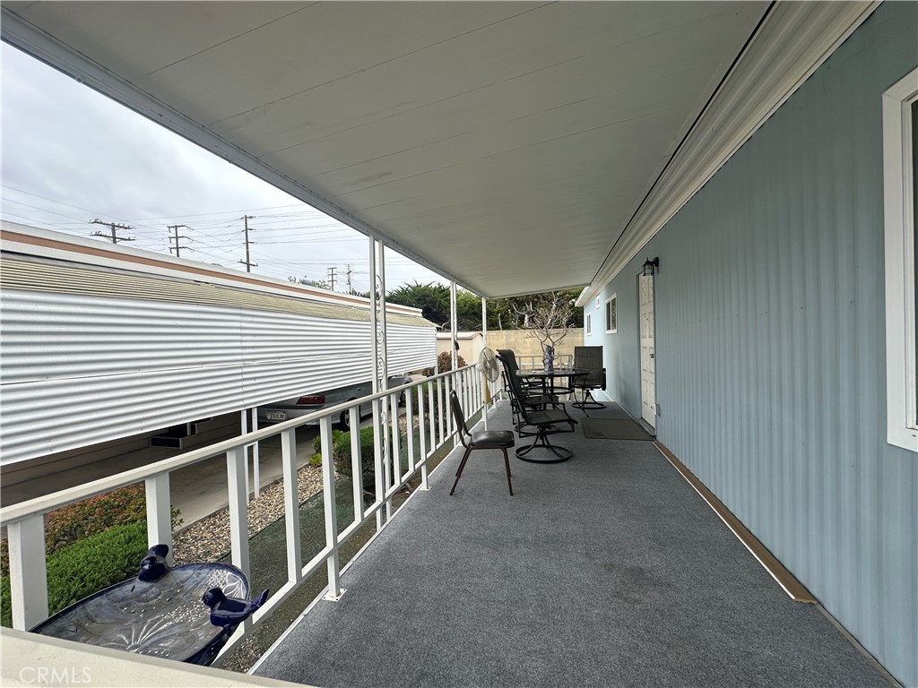525 North Gilbert Street, Unit 151 Anaheim, CA 92801 - Photo 6 of 18 a view of a porch with furniture and garden