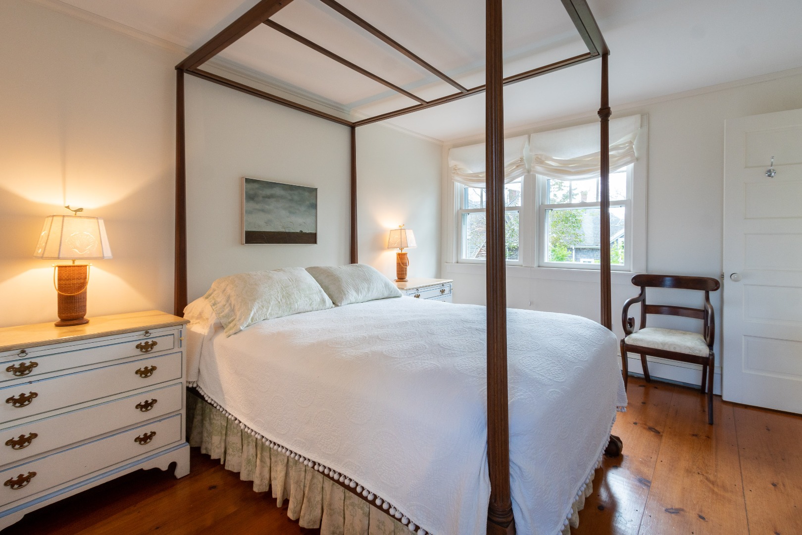 15 Cliff Road Nantucket, MA 02554 - Photo 40 of 50 a bedroom with a bed and a chandelier