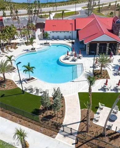 a view of a swimming pool with a table and chairs