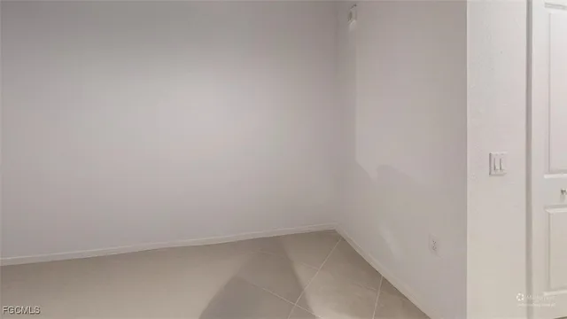 a kitchen with granite countertop a sink dishwasher stove and refrigerator with wooden floor