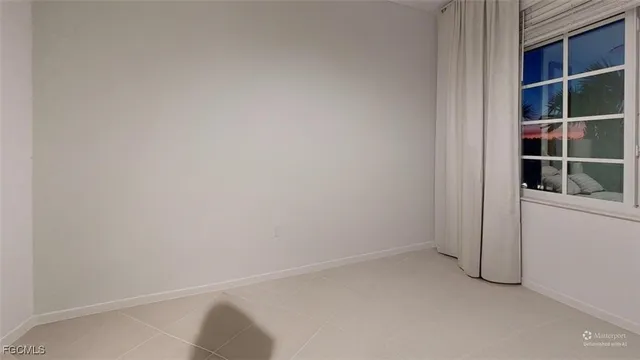 a kitchen with a sink stainless steel appliances a refrigerator and cabinets