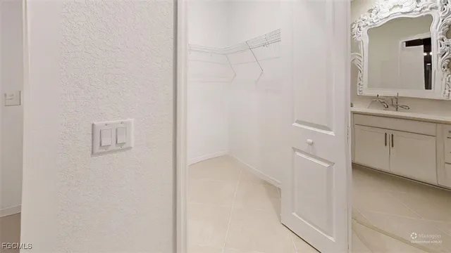 a view of a patio with a table and chairs