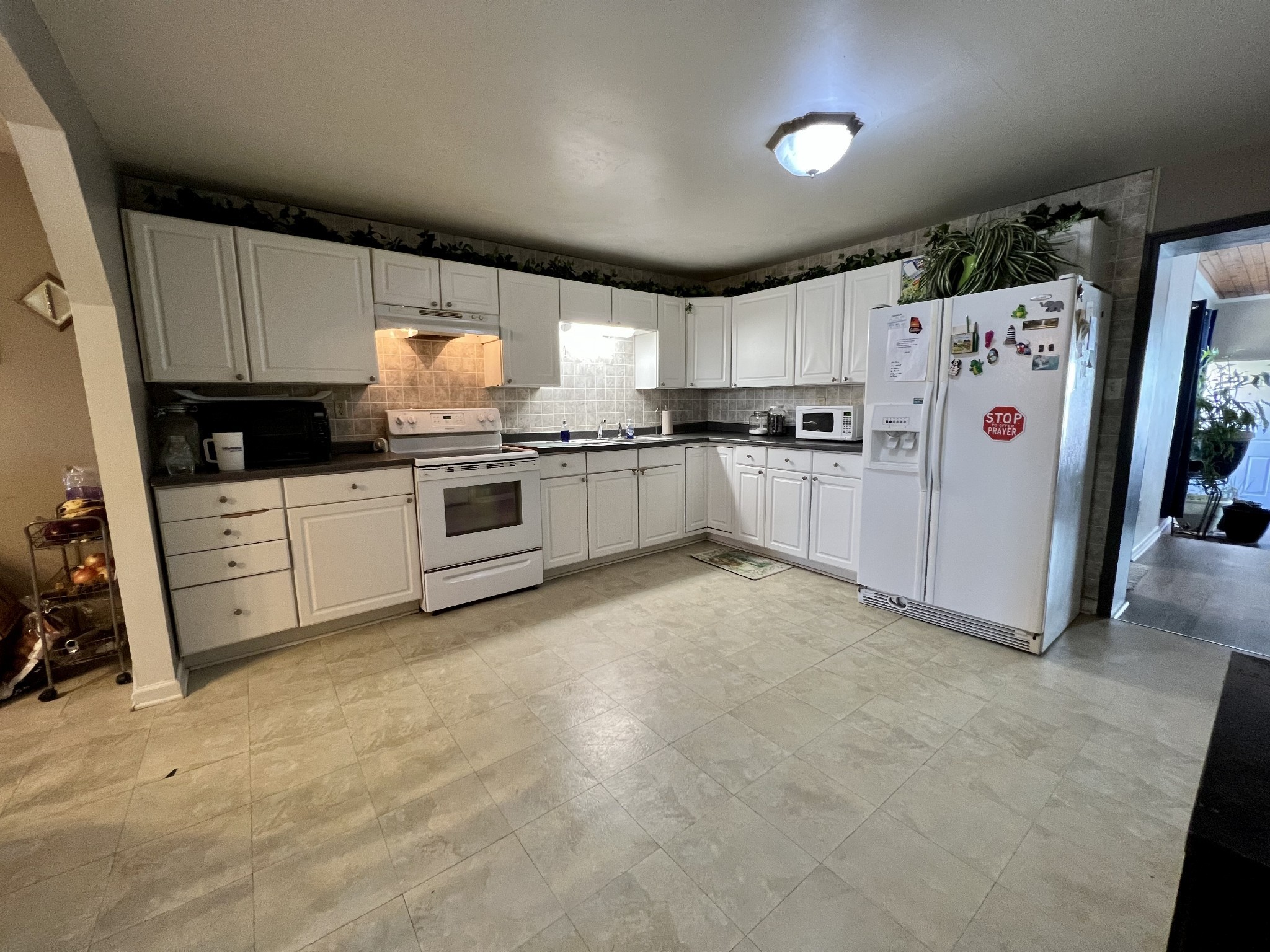 1076 Southside Road Southside, TN 37171 - Photo 6 of 27 a kitchen with stainless steel appliances and white cabinets