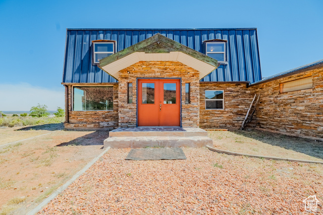 6178 East Zion Road Kanab, UT 84741 - Photo 2 of 48 Doorway to property featuring stone siding and french doors